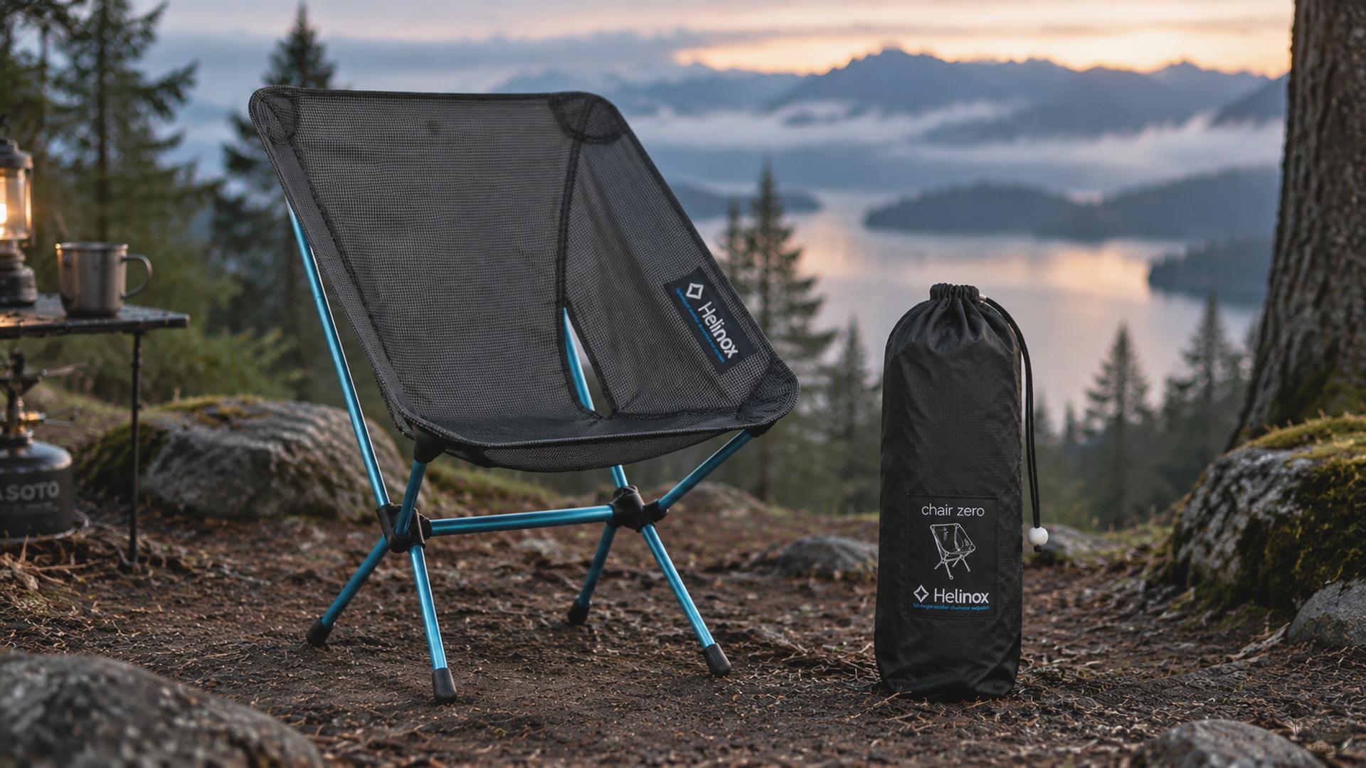 Helinox Chair Zero Black assembled beside its official packed cinch bag in forest light