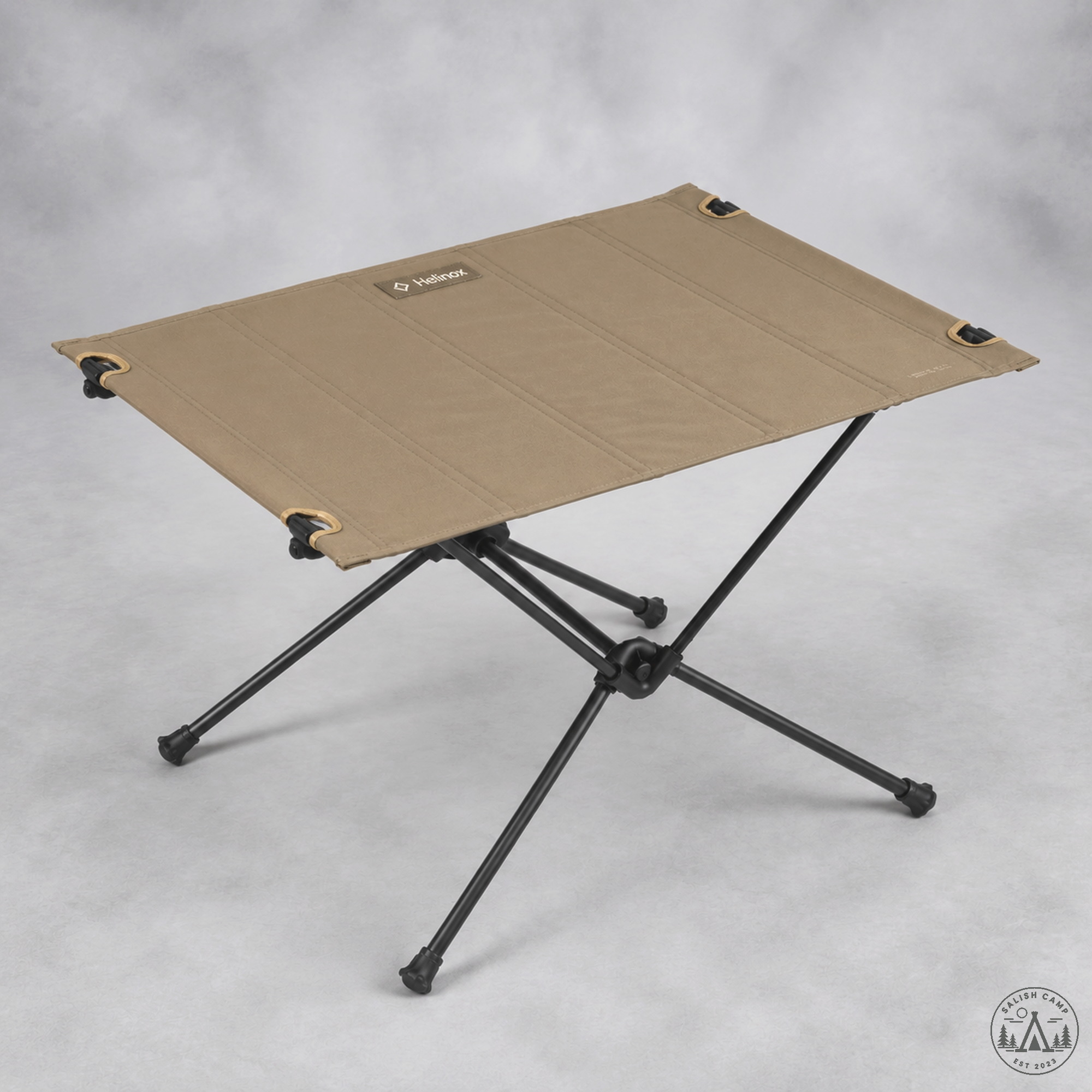 Helinox Table One Hard Top Coyote Tan three-quarter view with matte-black DAC X-frame