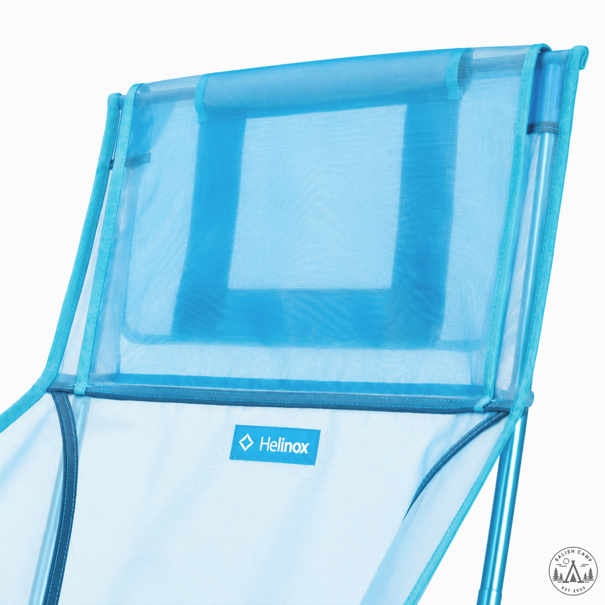 Close-up of the mesh headrest flap at the top of the Blue Mesh chair back, with a small Helinox tab below it