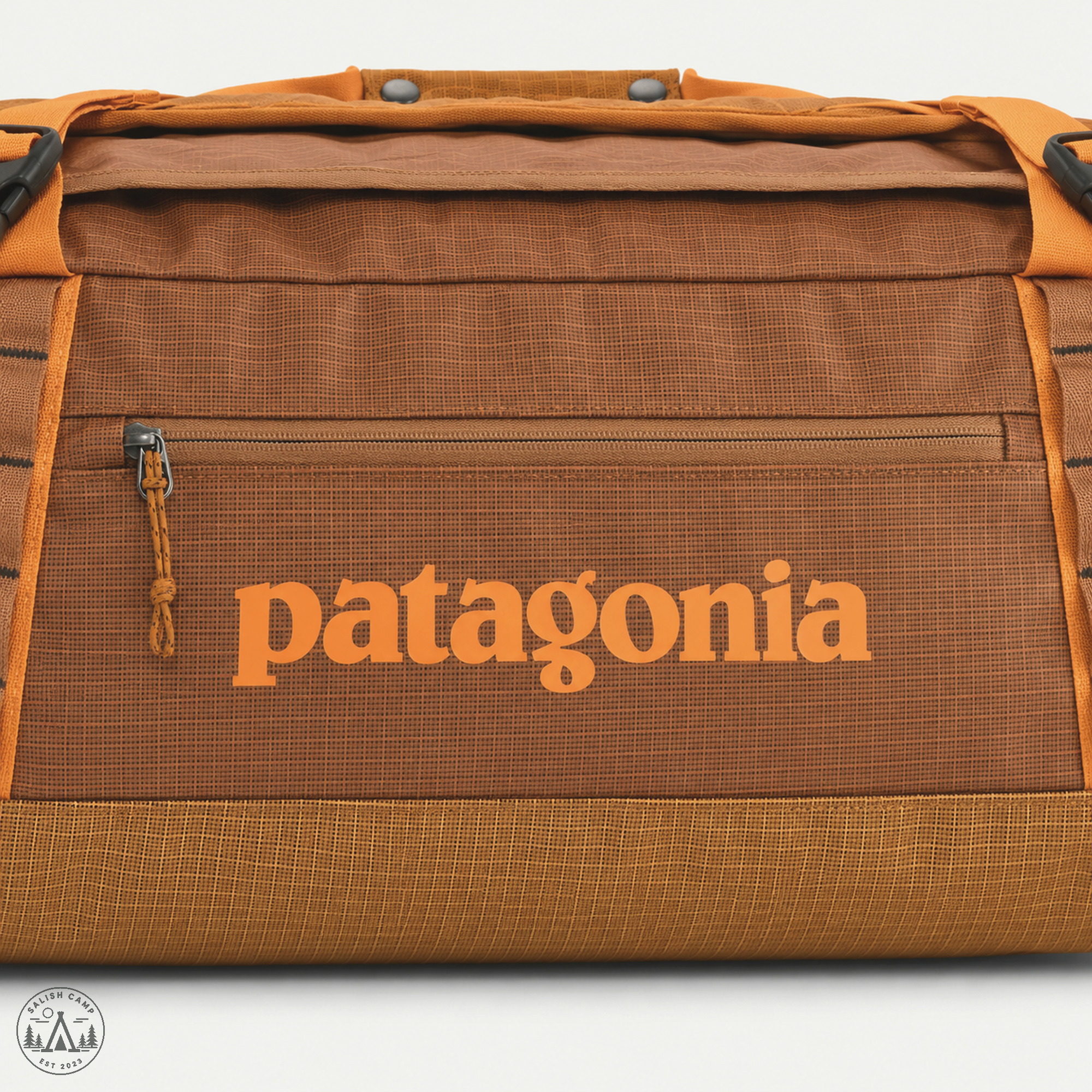 Black Hole 55L orange patagonia wordmark close-up