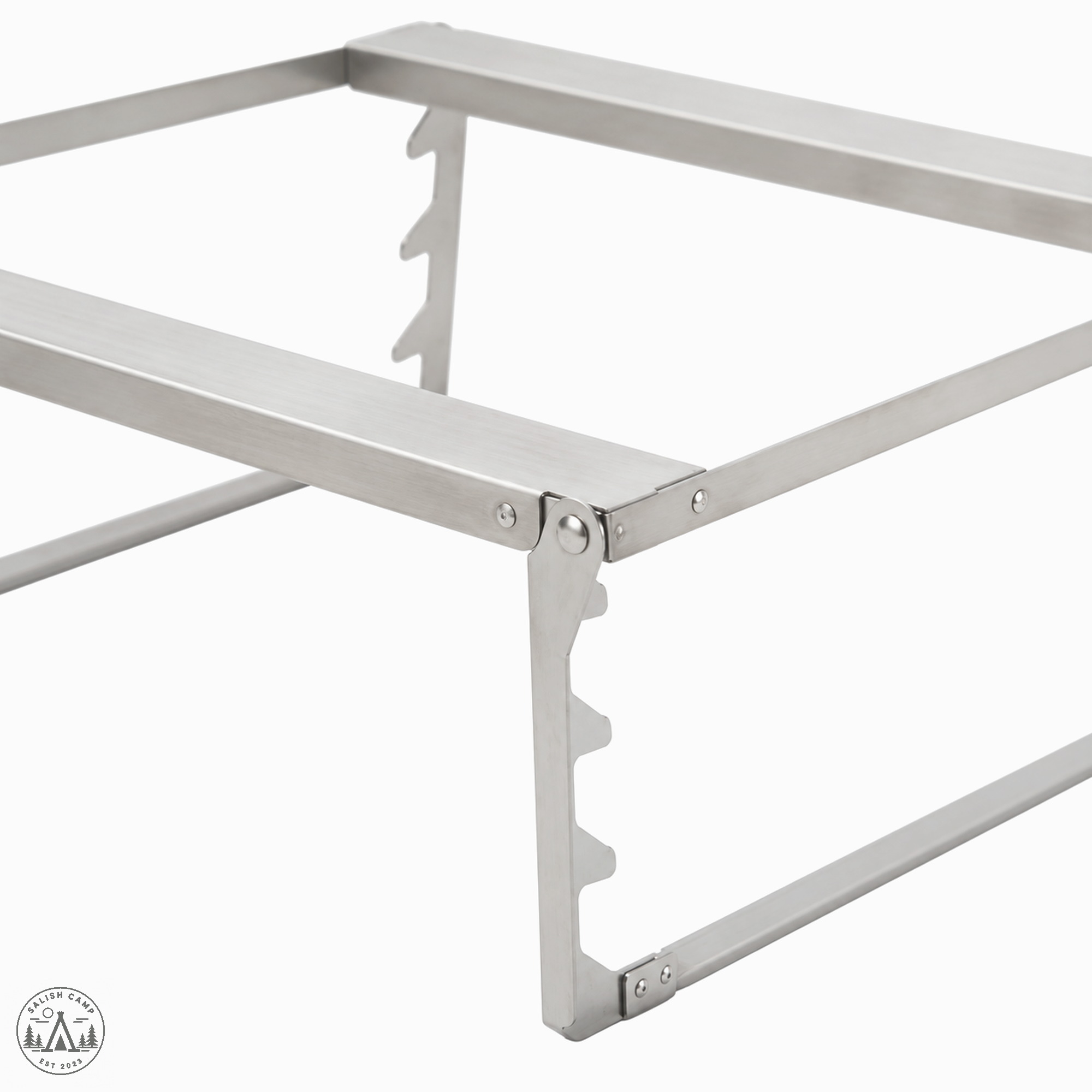 Close crop of the Fireplace Grill Bridge L notched support rails and pivot hardware