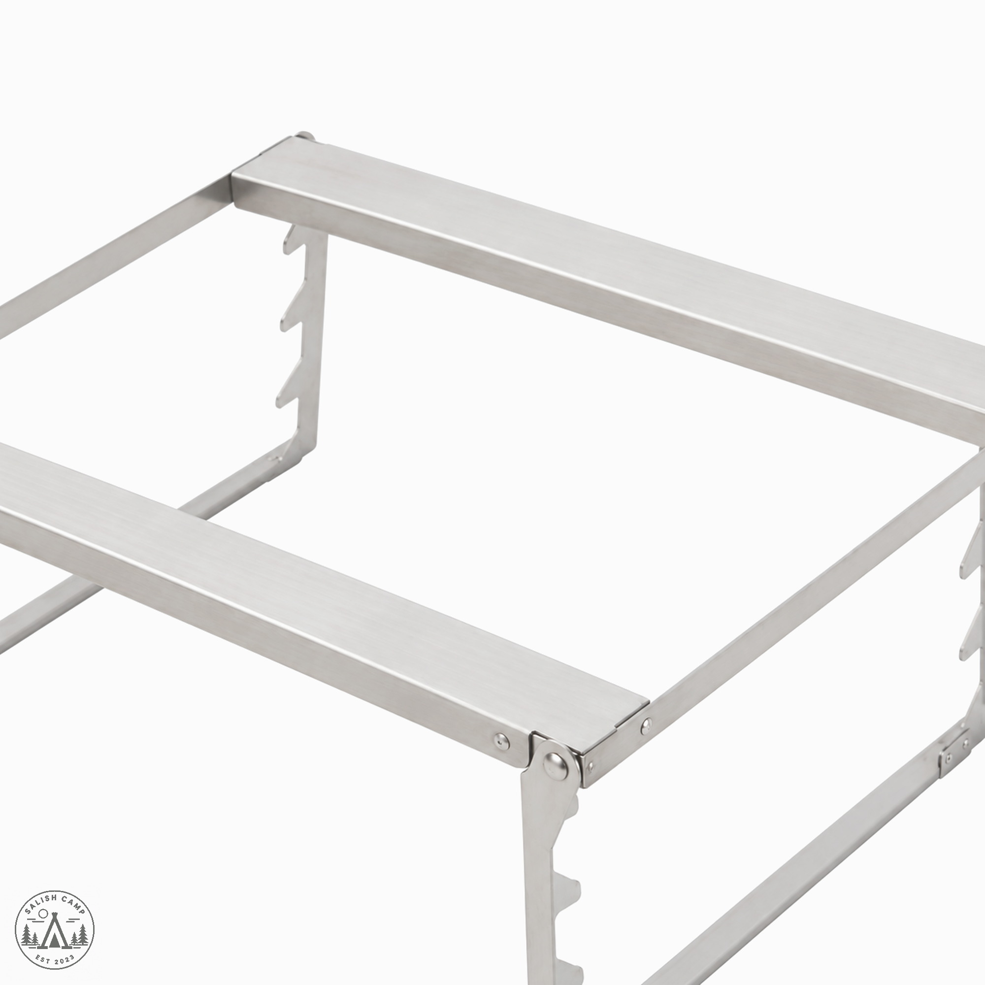 Close crop of the Fireplace Grill Bridge L stainless steel rails and notched support