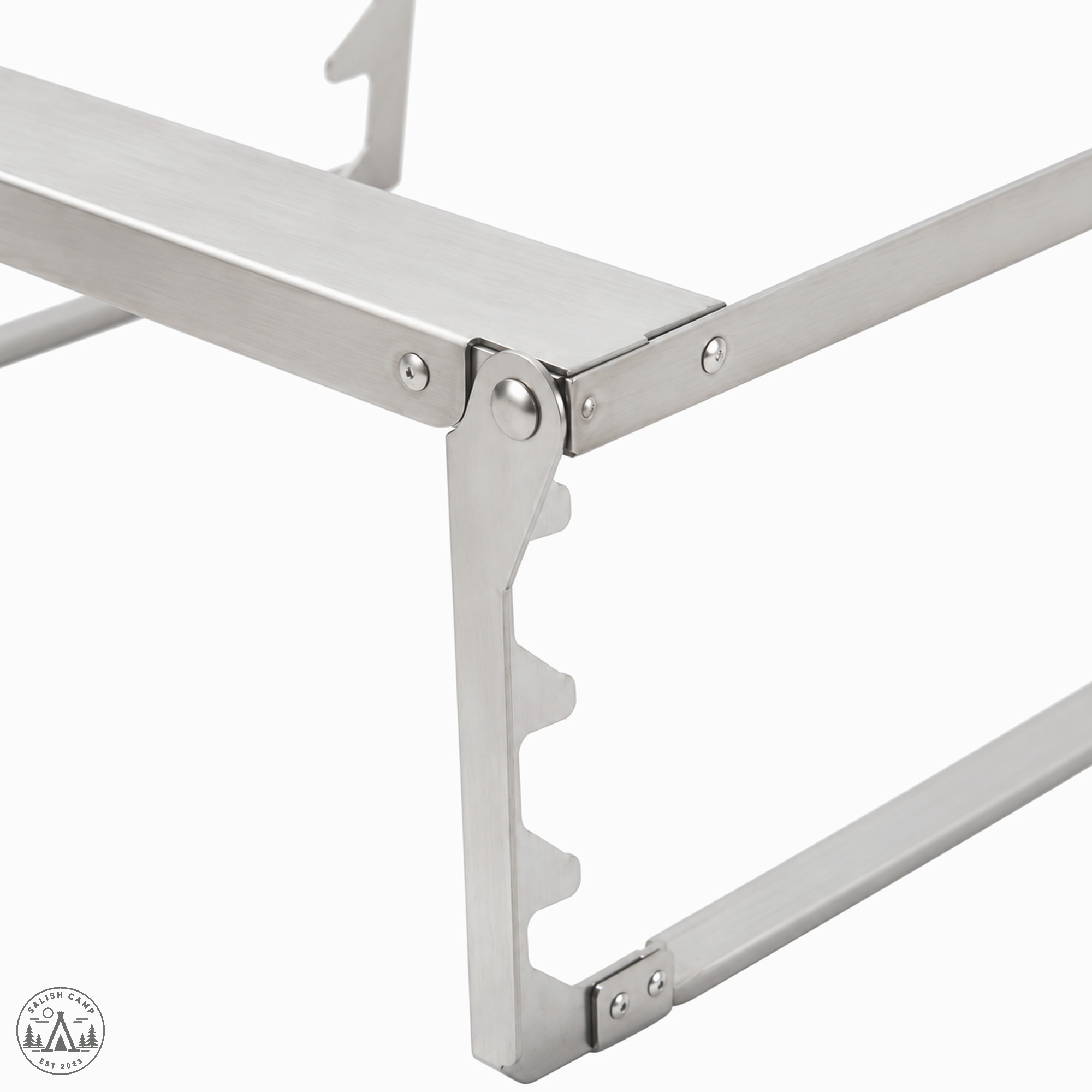 Close crop of the Fireplace Grill Bridge L stainless steel pivot joint and notched support rail