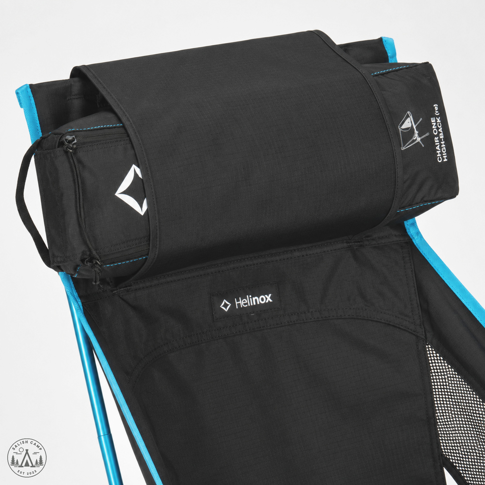 Close-up of the top of the Black Chair One High-Back (re), with the packed carry case tucked under the black flap