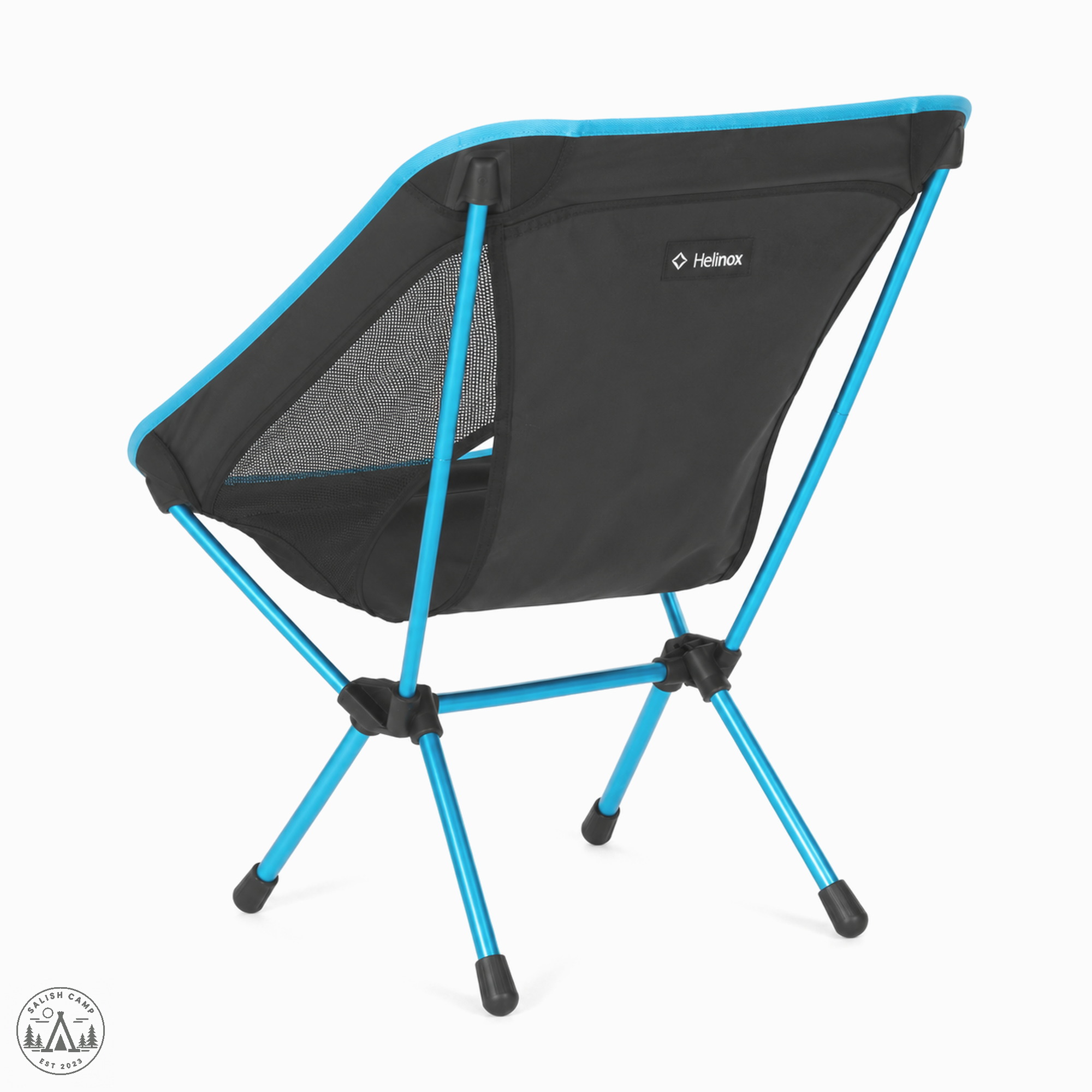 Back three-quarter view of the Helinox Chair One (re) in Black, with cyan poles and black hubs