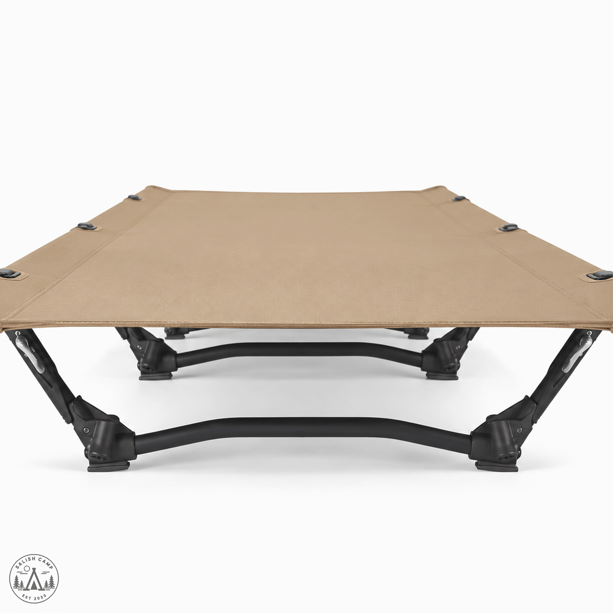 End-on view down the length of the Coyote Tan Helinox Cot One Convertible on white