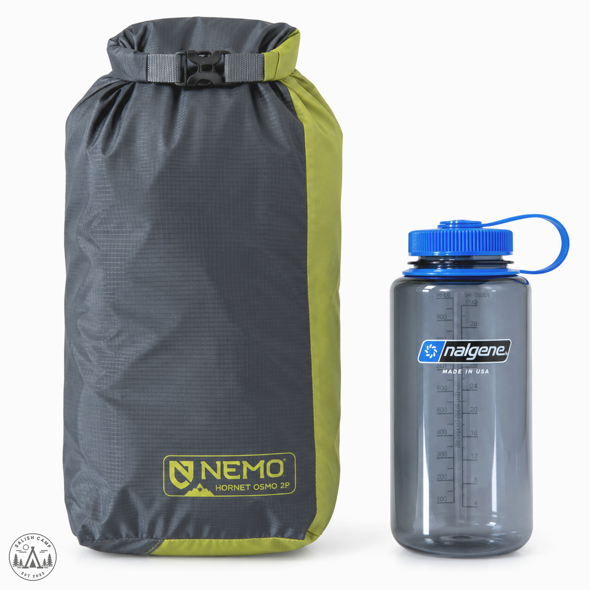 NEMO Hornet OSMO 2P packed in its Divvy Cube stuff sack beside a Nalgene bottle