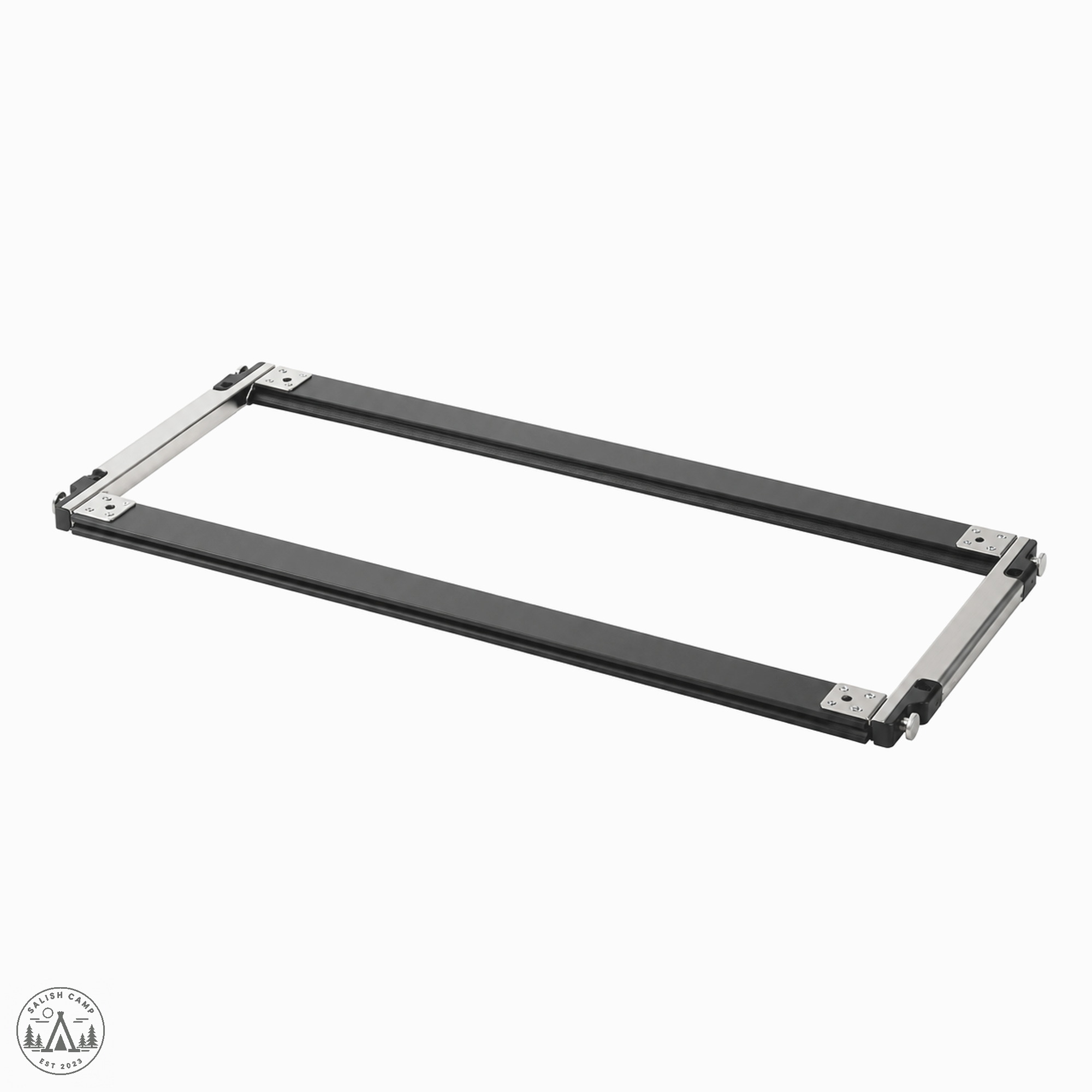 Assembled rectangular frame on white, two long black rails and two short silver ends, open center