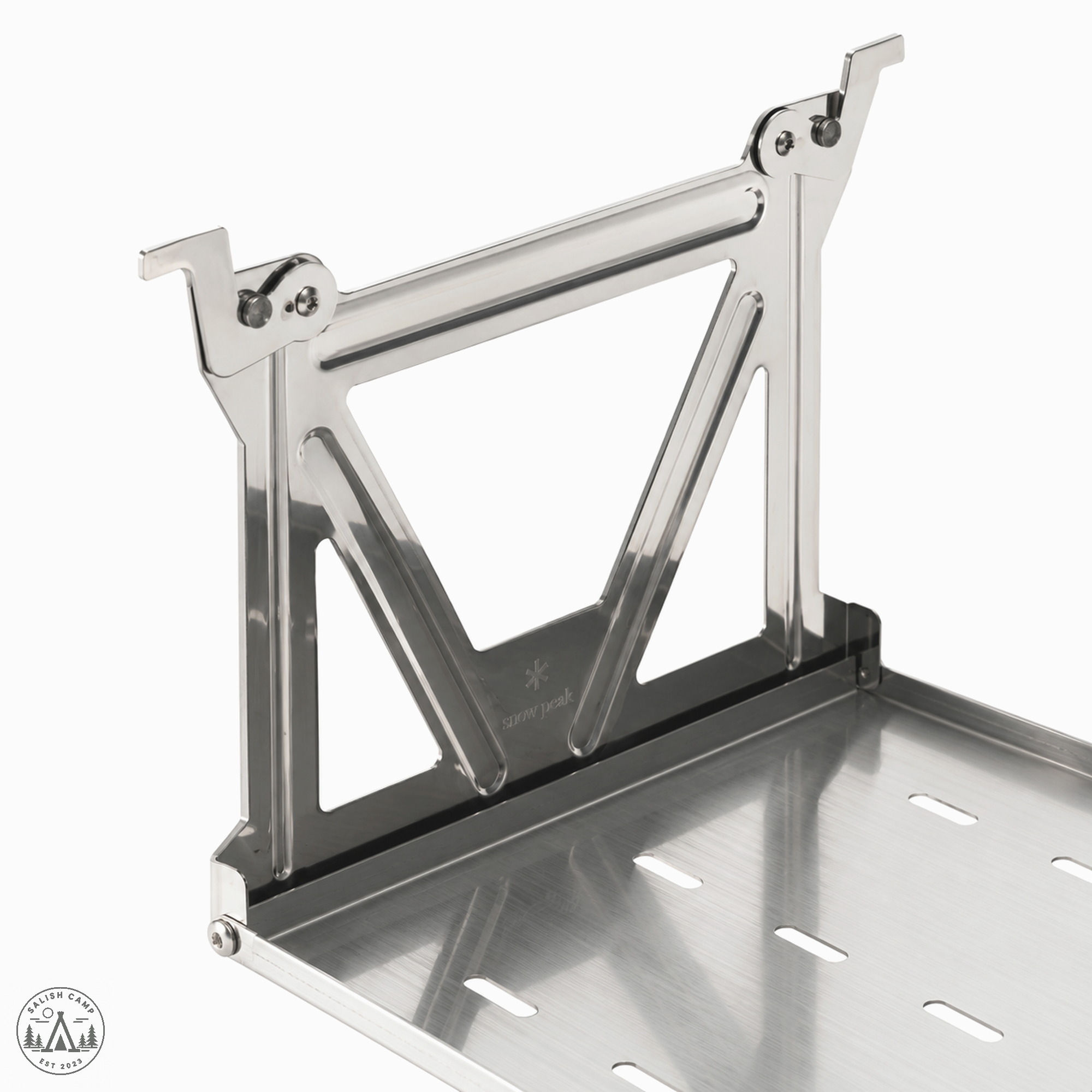 Close-up of one stainless end bracket with triangular brace, hook tips, and slotted shelf deck