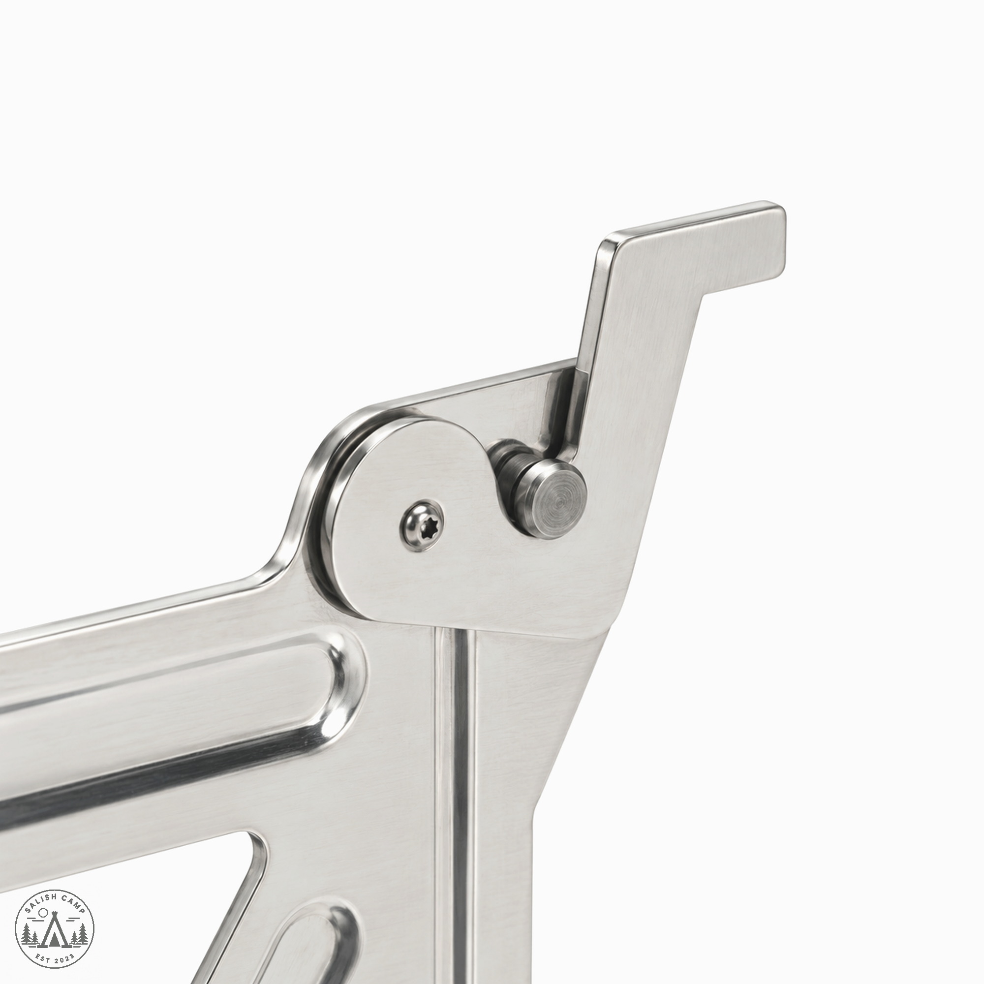 Close-up of one stainless hook tip, round pivot pin, and small screw