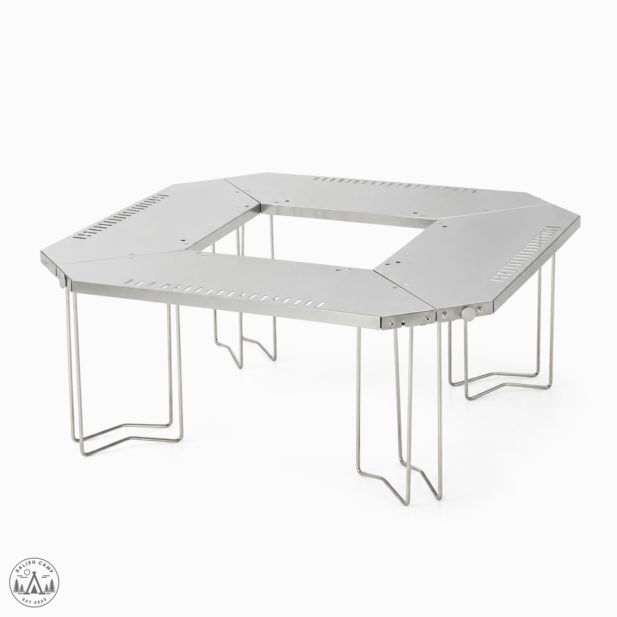 Lower three-quarter view of the empty Jikaro stainless ring on white, wire legs and one side knob
