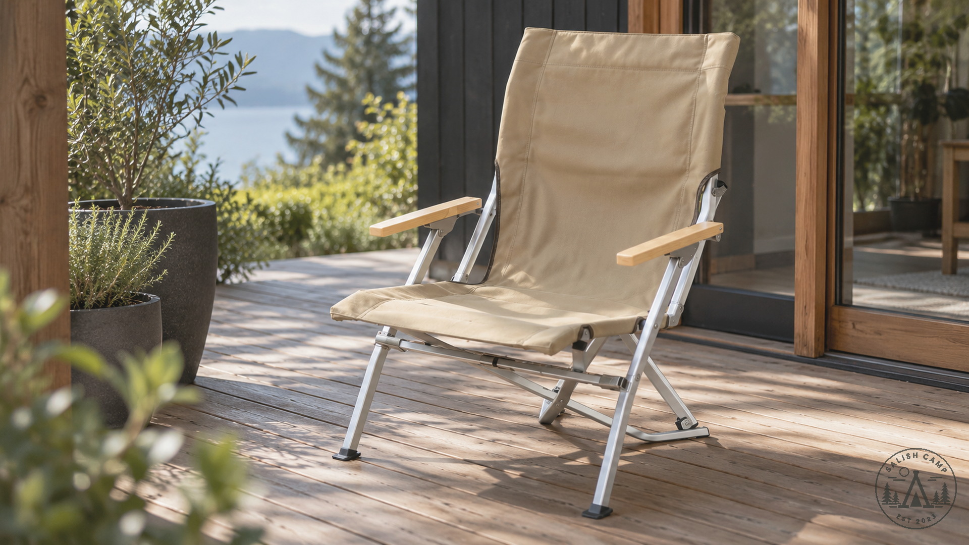Empty Khaki Low Beach Chair on a wood deck outside glass doors