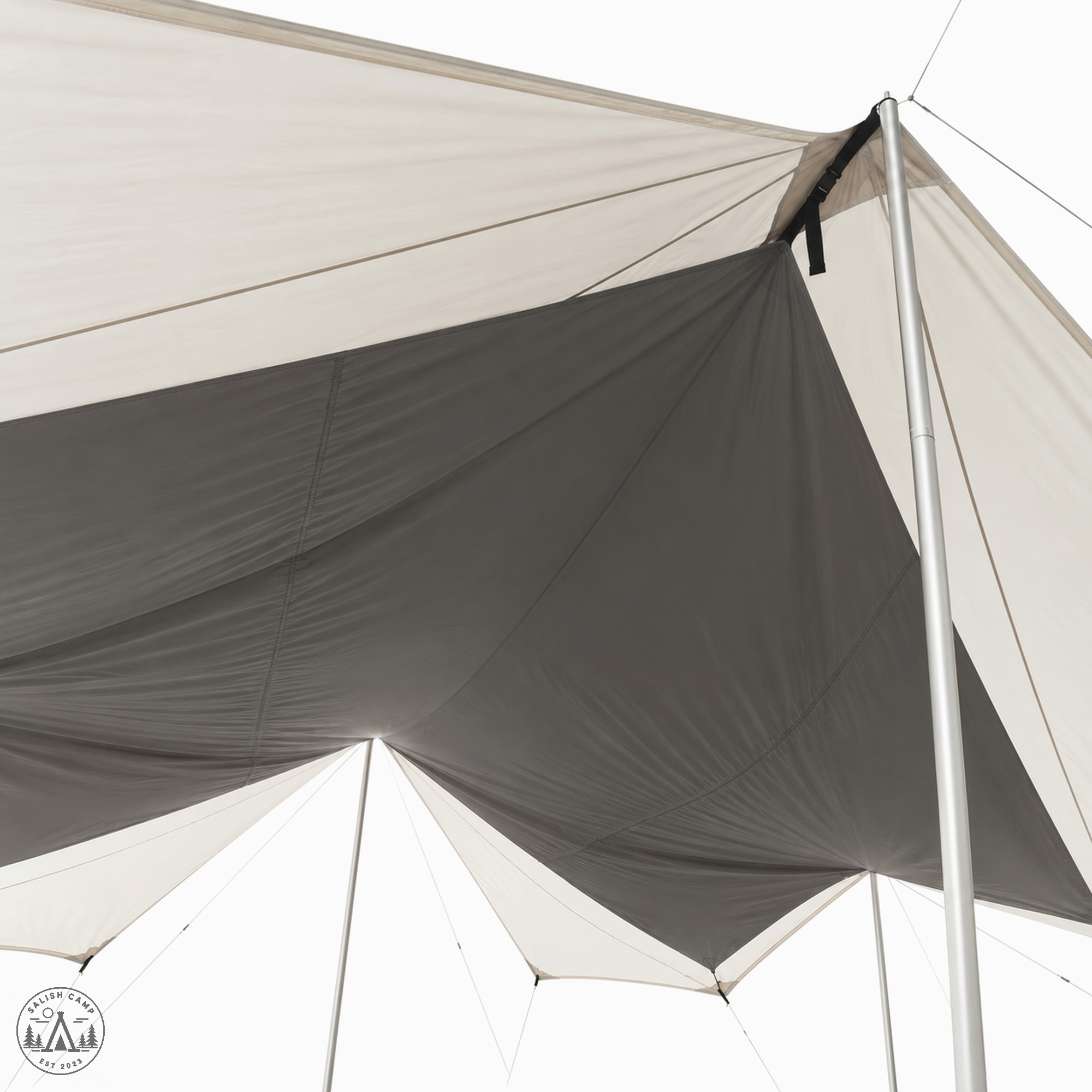 Dark inner panel hanging under the light Takibi Tarp Octa shell, with a silver pole and black strap