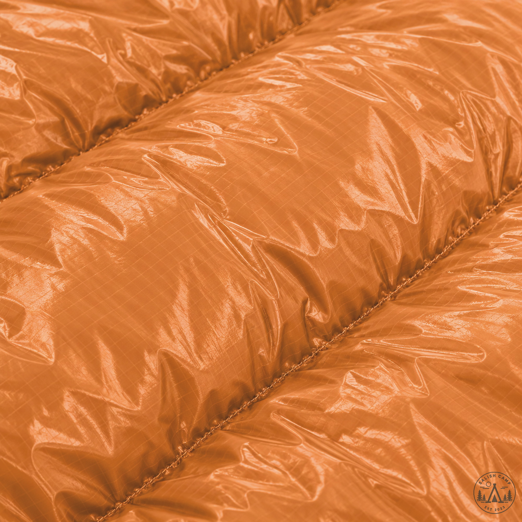 Close-up of Burnt Orange 10D Revelation shell fabric and loft
