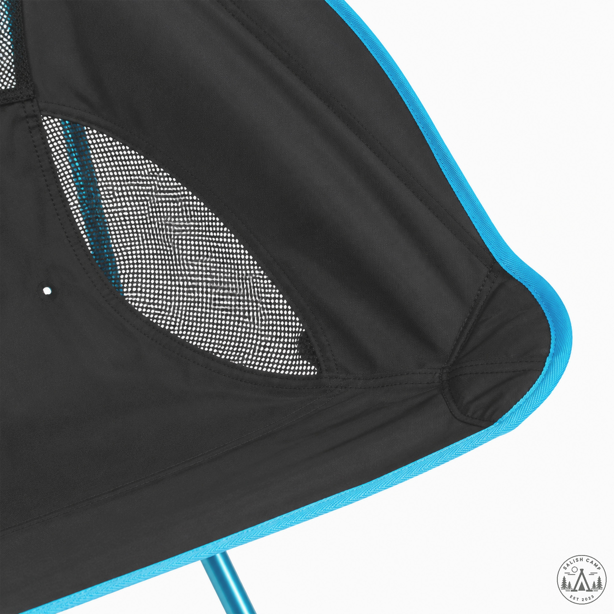 Close-up of a mesh panel and seat corner on the Black Helinox Savanna Chair, with cyan binding