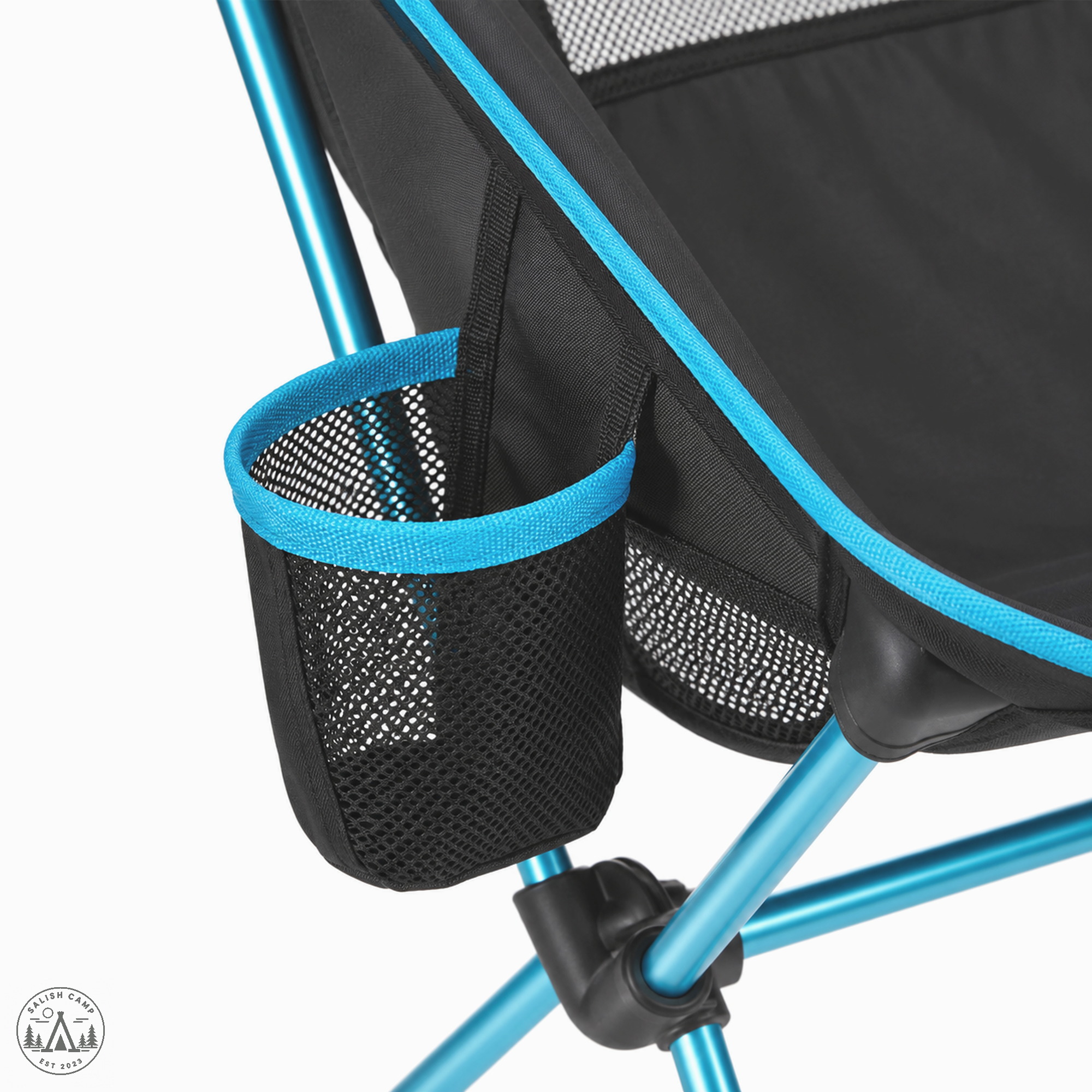 Close-up of an empty black mesh cup holder with a cyan rim on the side of the Black Helinox Savanna Chair
