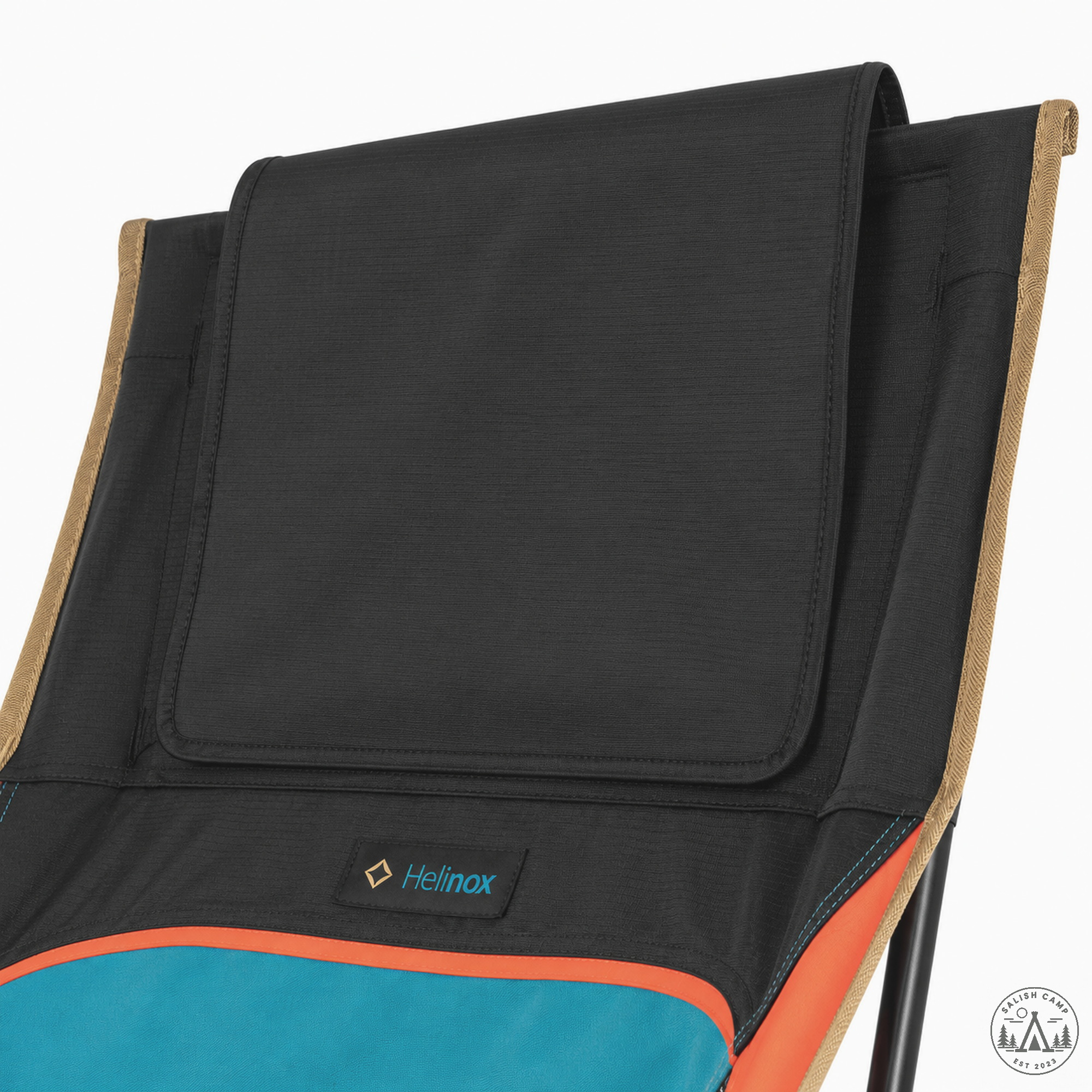 Close-up of the black headrest flap at the top of the chair back, with a small Helinox tab below it