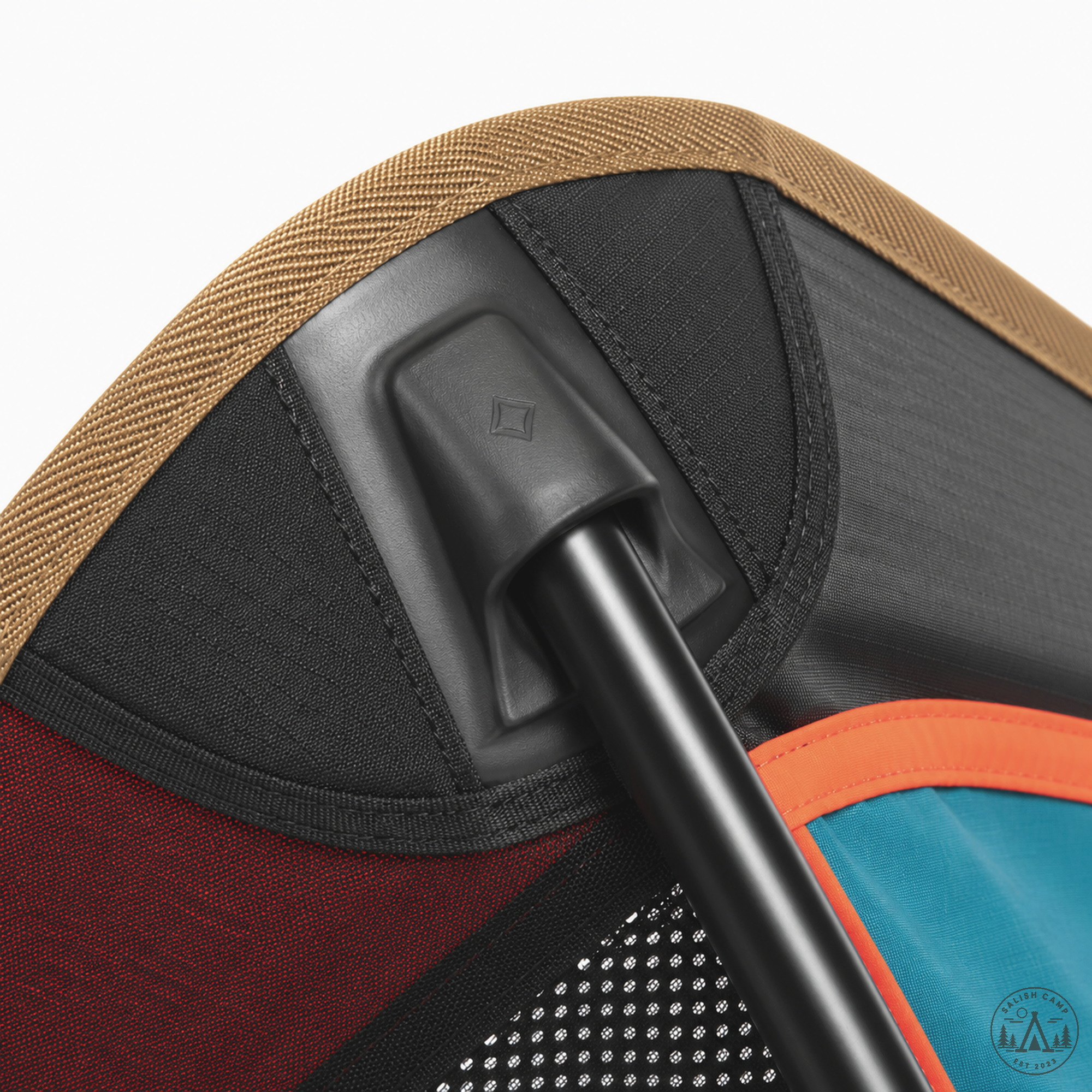 Close-up of a molded black corner pole pocket with a black pole seated in it