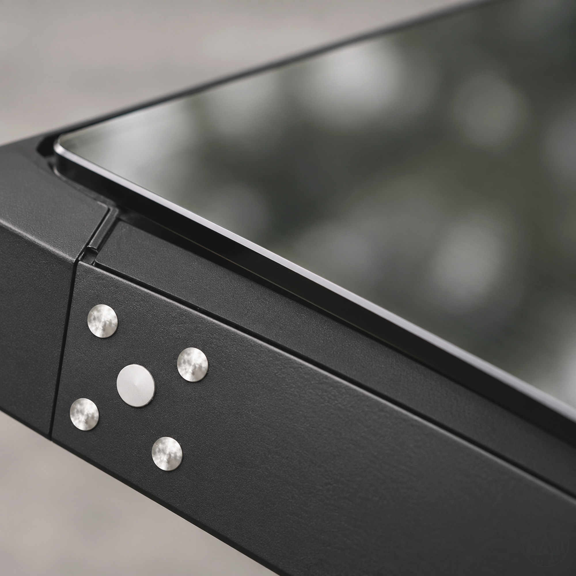 Close-up of the riveted end of the armor glass insert