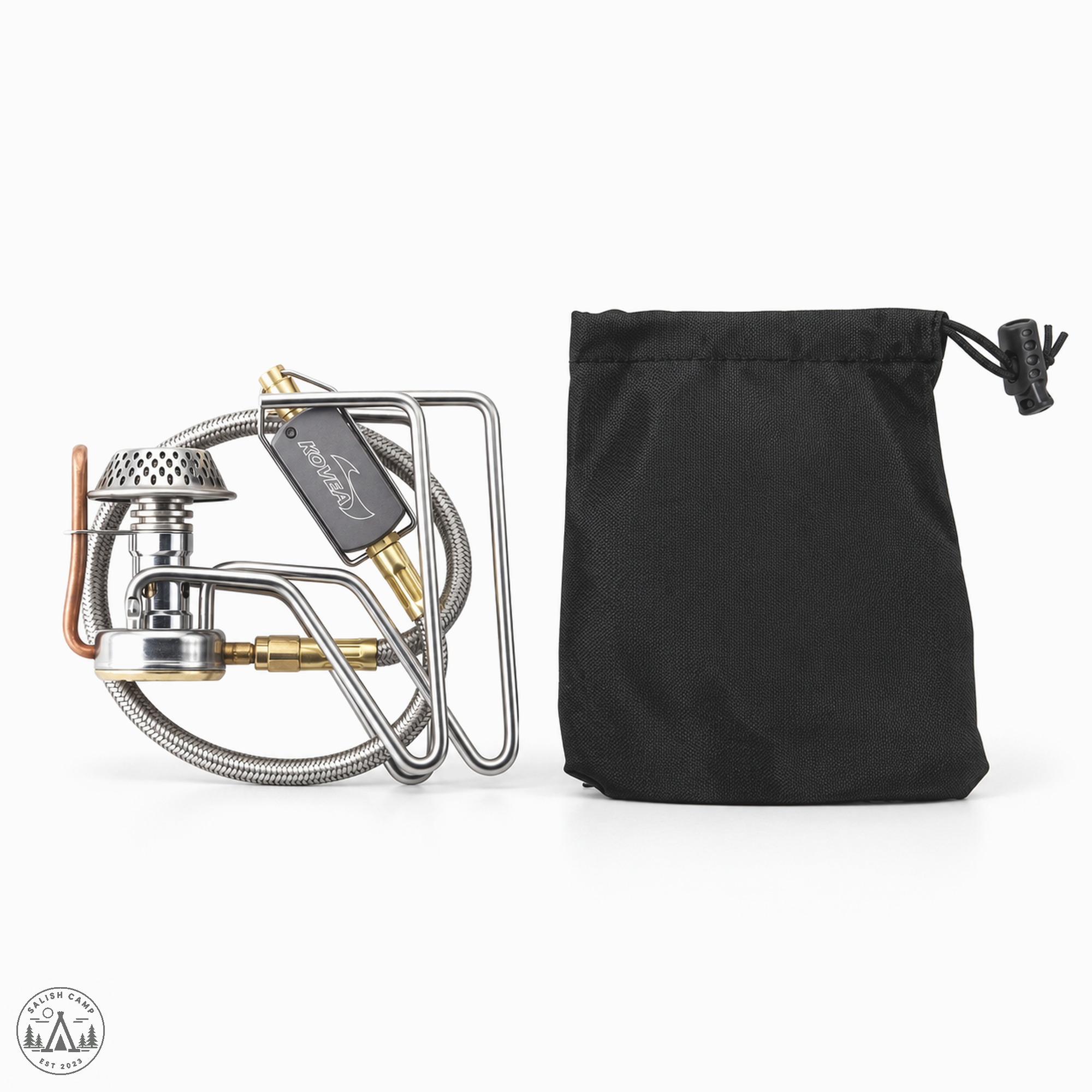 Folded Kovea Spider stove beside its black drawstring sack