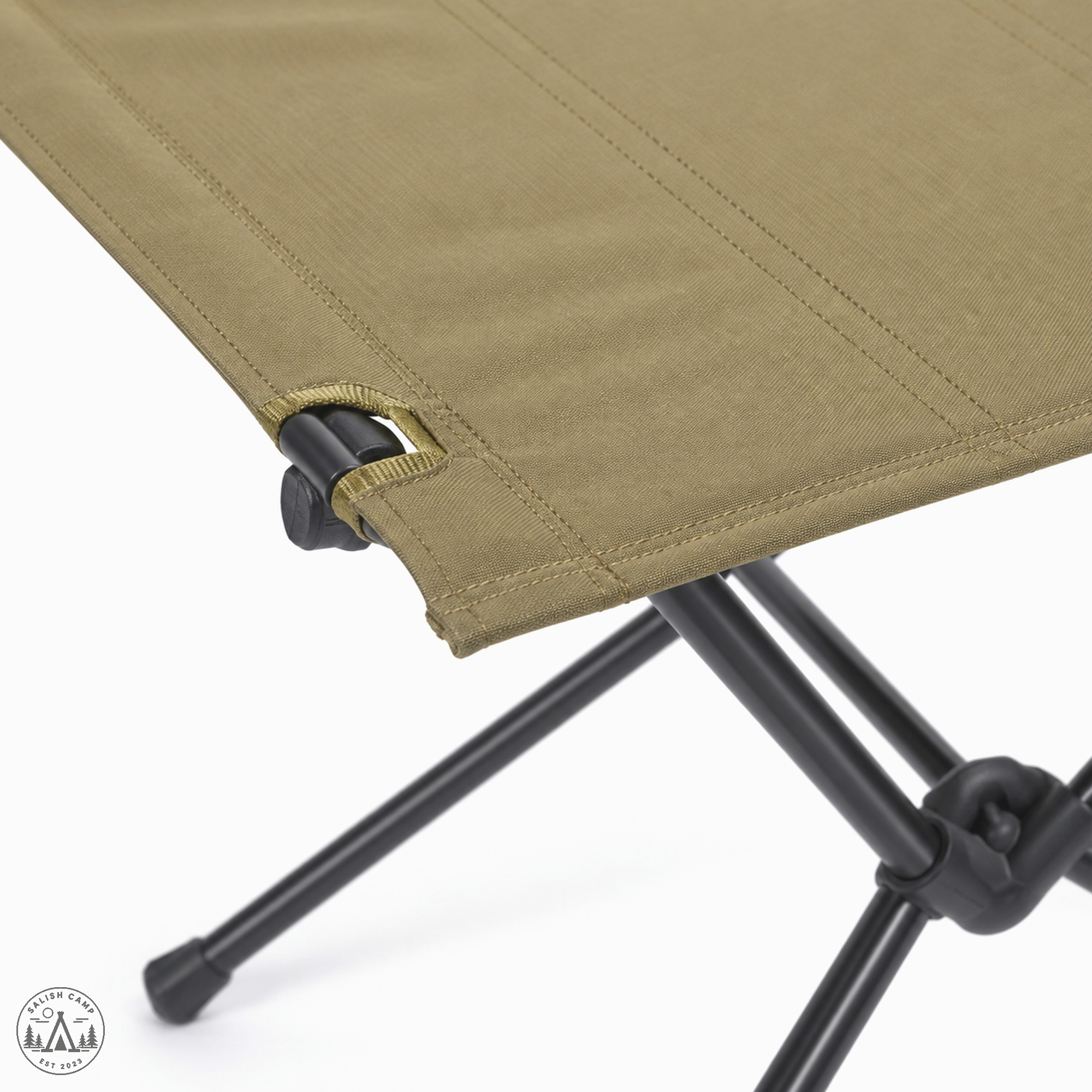 Corner of the Coyote Tan Tactical Table One top with the frame below
