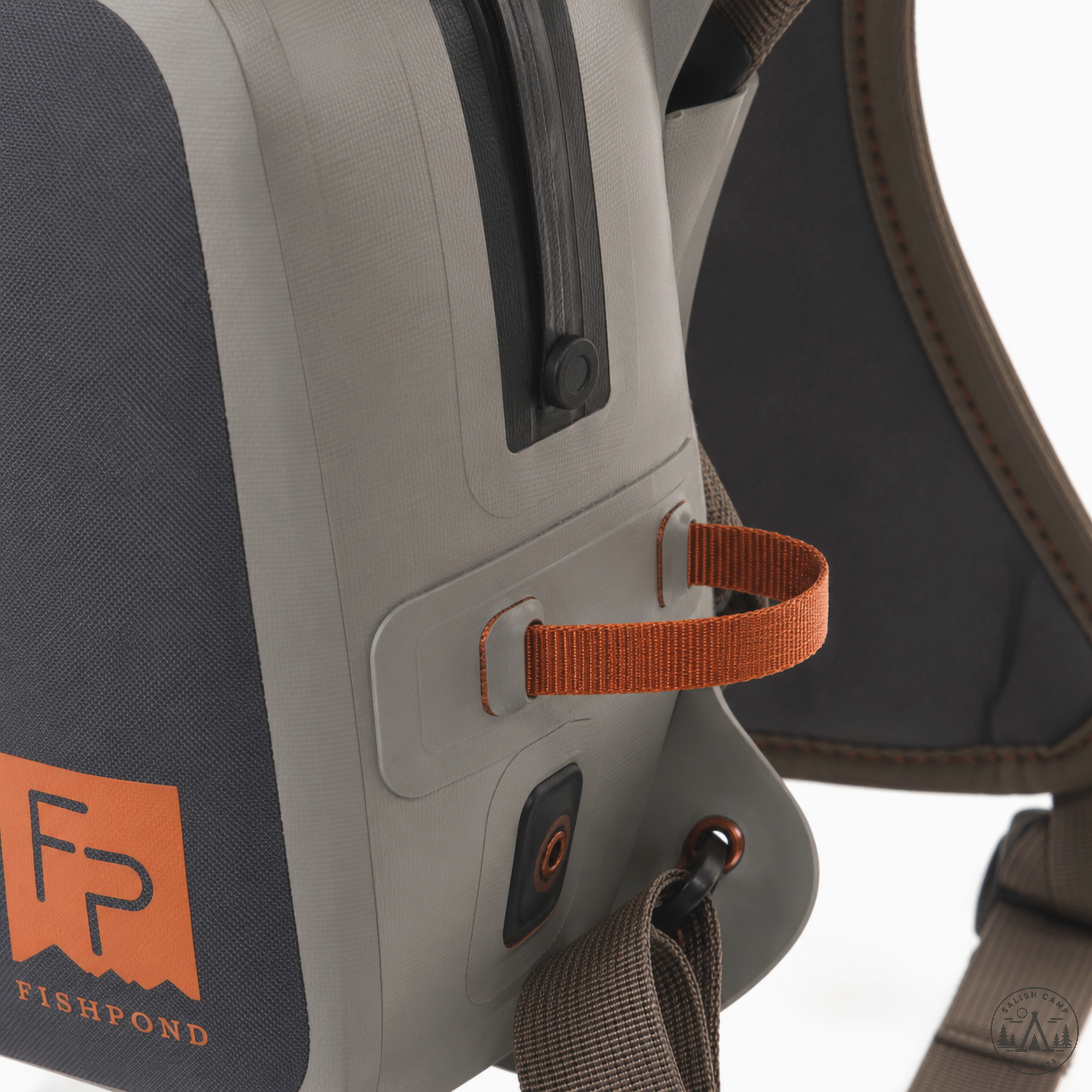 Close-up of orange exterior attachment tab on the Thunderhead Eco Shale chest pack
