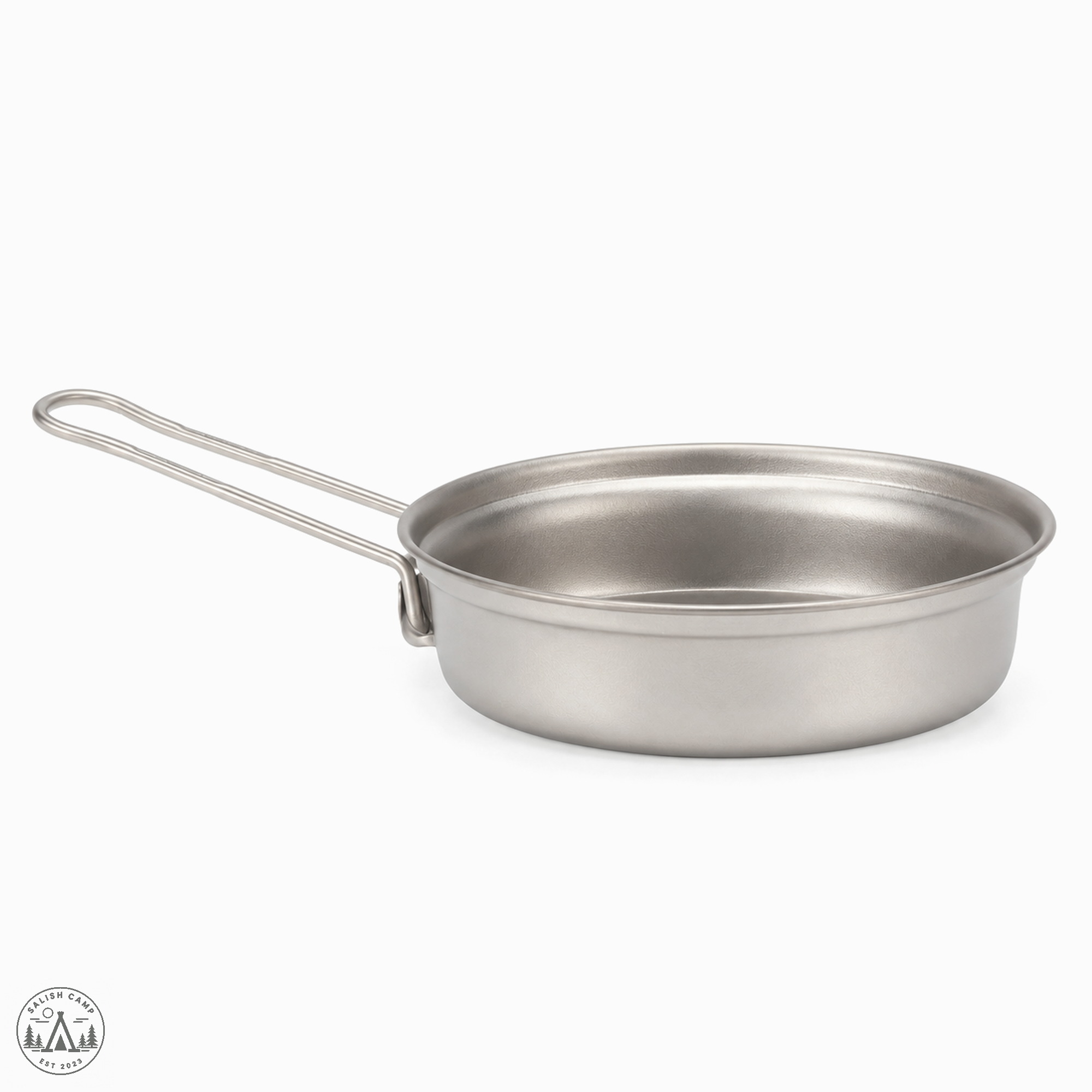 One shallow titanium Trek 1400 fry pan with a long wire handle extended