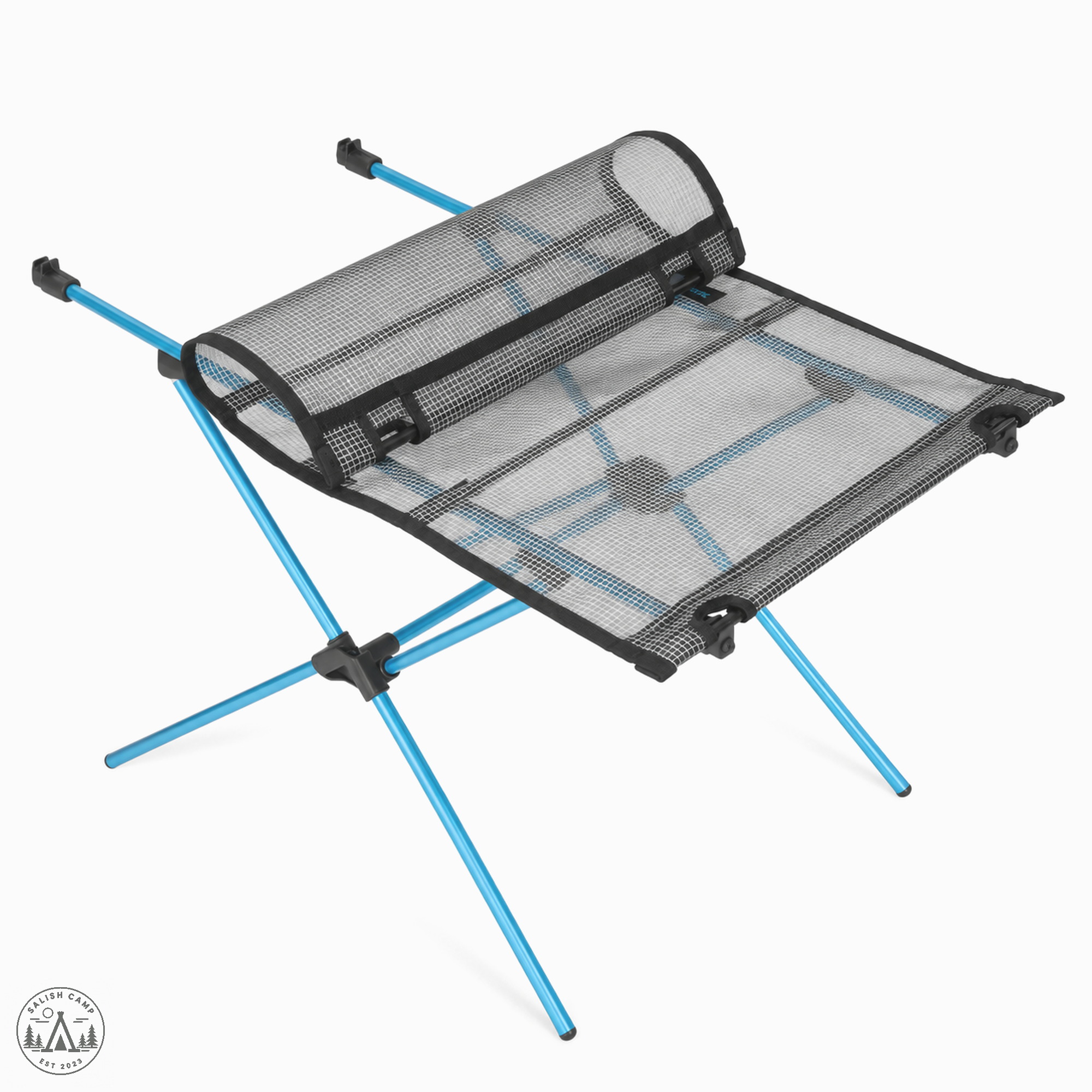 Table Zero LT with one end of the mesh top rolled back over the open cyan legs