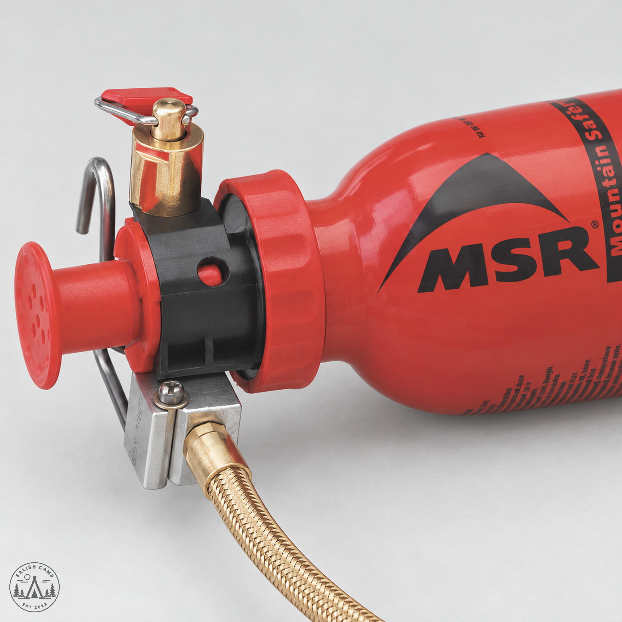 MSR WhisperLite red pump and control valve in the fuel bottle