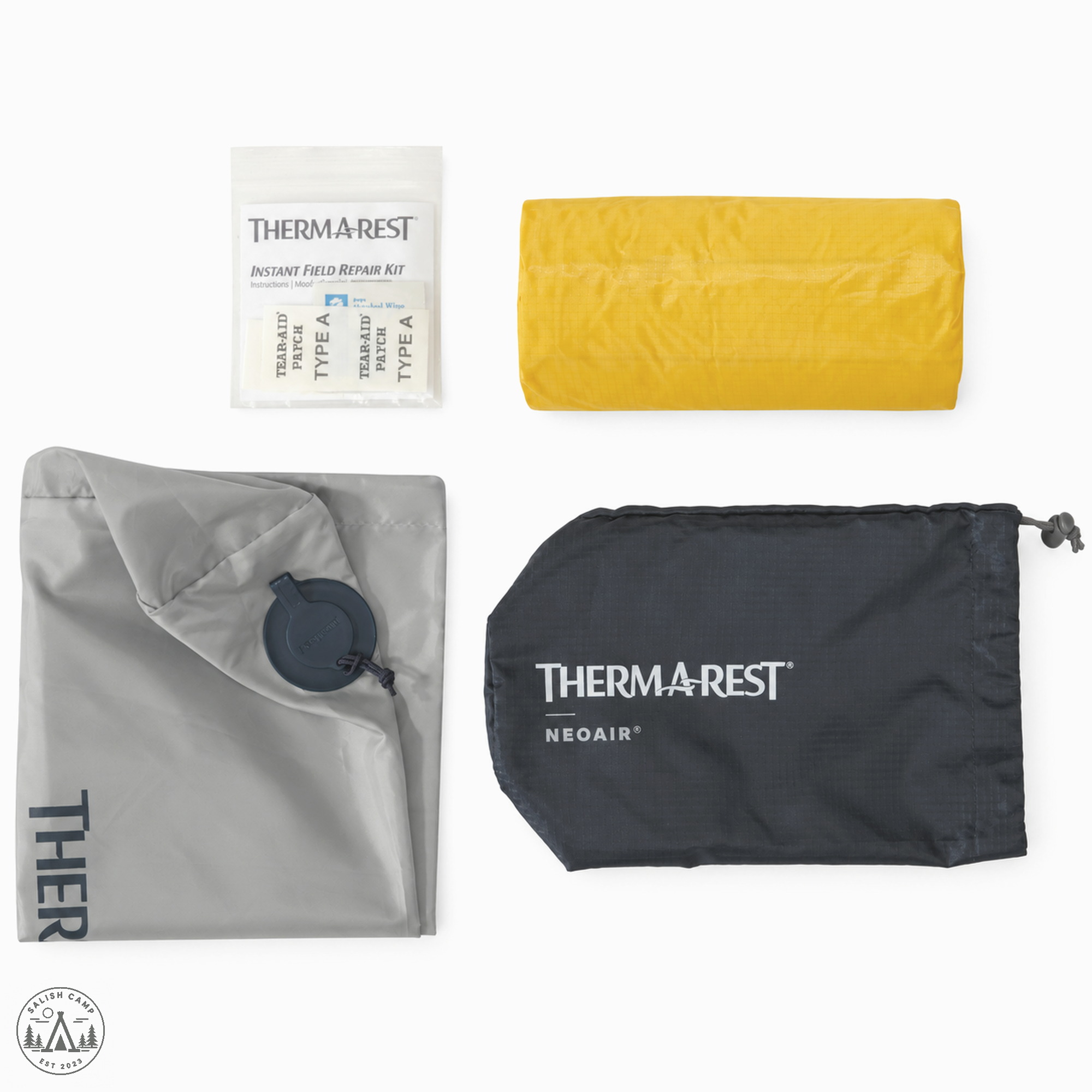 NeoAir XLite NXT contents flat lay: pump sack, stuff sack, field repair kit, and rolled Solar Flare pad